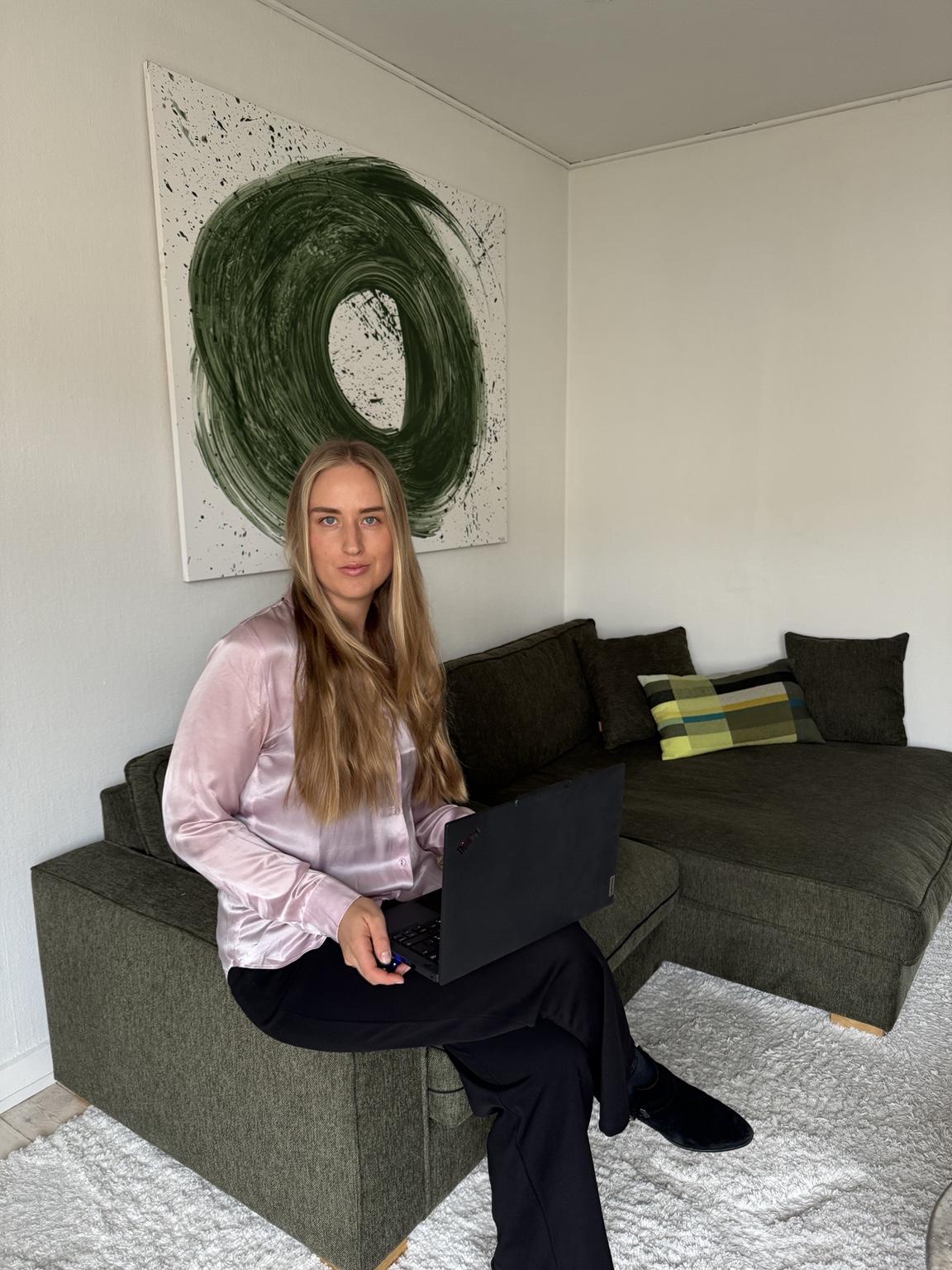 Anna Katharina seated with her laptop